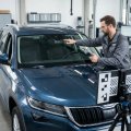 Technician performing ADAS calibration on a vehicle