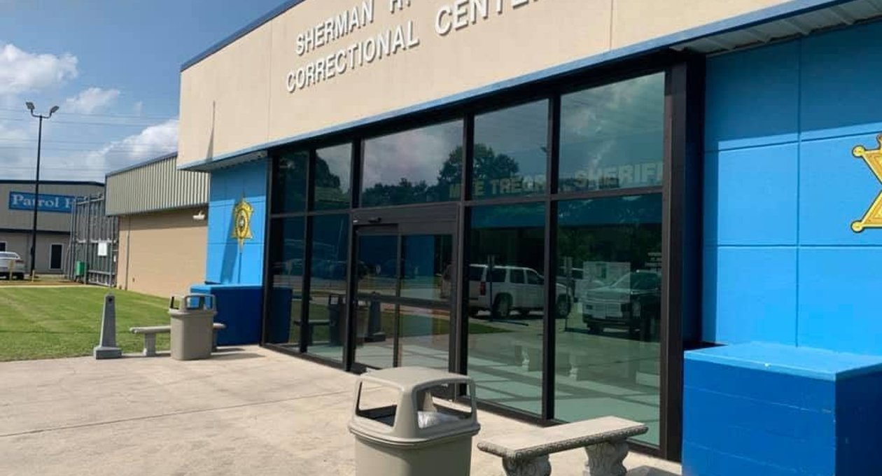 Commercial entrance with glass doors and sidelites in Southeast Louisiana