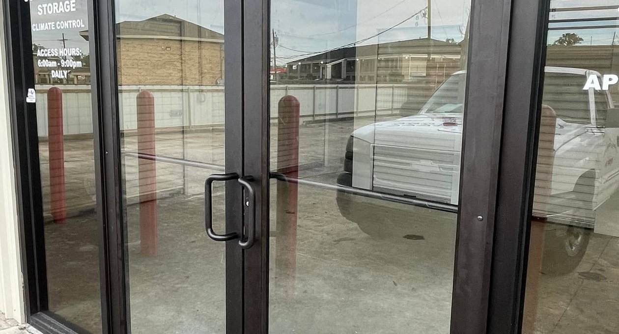 Aluminum storefront doors with pull handle and panic bar repaired in LaPlace, LA