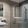 Custom glass shower door installed in a modern bathroom
